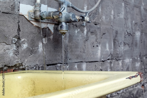 Wallpaper Mural An old washbasin in a shabby place in a poor quarter. Kitchen under repair Torontodigital.ca