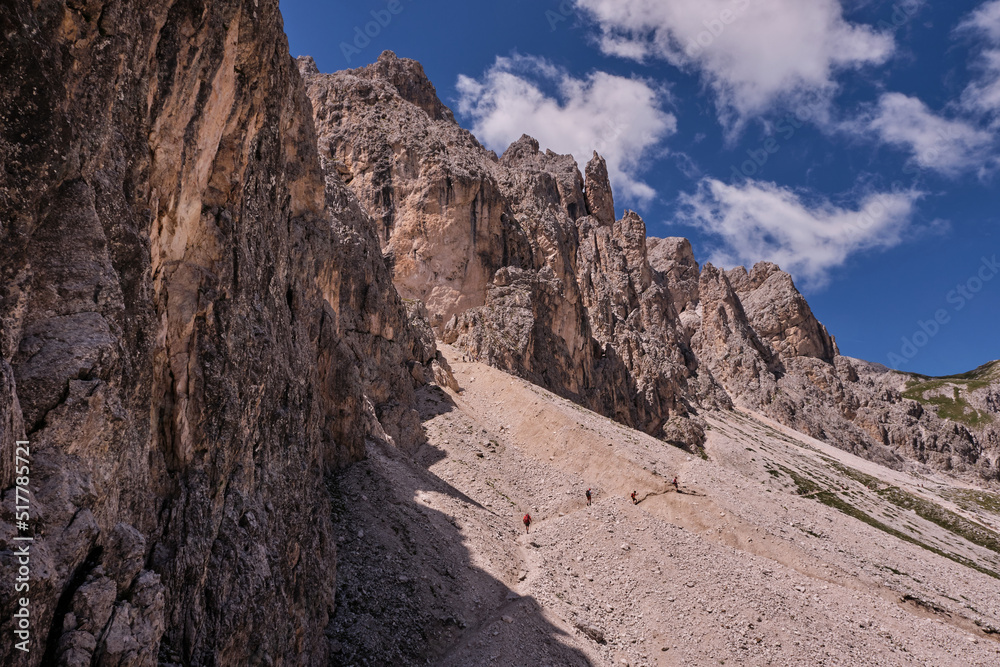 climbers who walk in the mountain complex of the catinaccio dolomites trentino alto adige