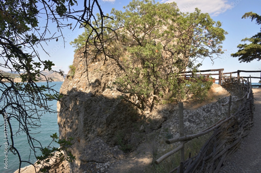 The Golitsyn trail is a mountain trail cut into the slope of Mount Koba-Kaya, along the coastal village of Novy Svet, Crimea, Russia The Golitsyn trail is a mountain trail cut into the slope of Mount Koba-Kaya, along the coastal village of Novy Svet, Crimea, Russia