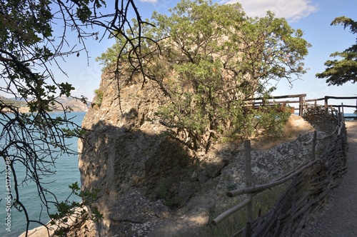 The Golitsyn trail is a mountain trail cut into the slope of Mount Koba-Kaya, along the coastal village of Novy Svet, Crimea, Russia photo