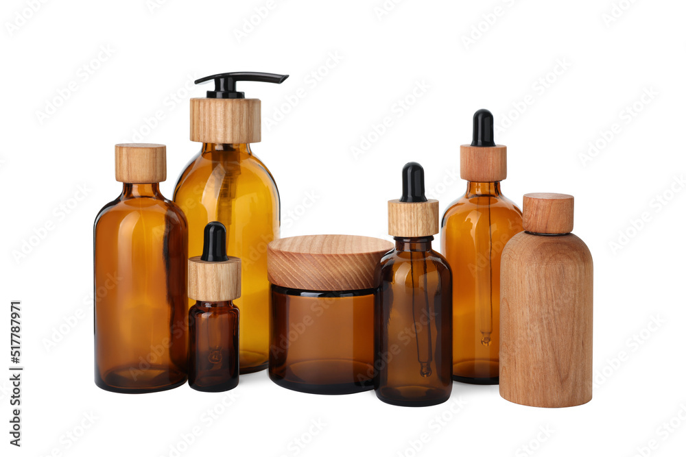 Set of stylish glass and wooden containers isolated on white