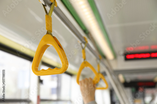 Fotografie Grab pole with handgrip handles in public transport
