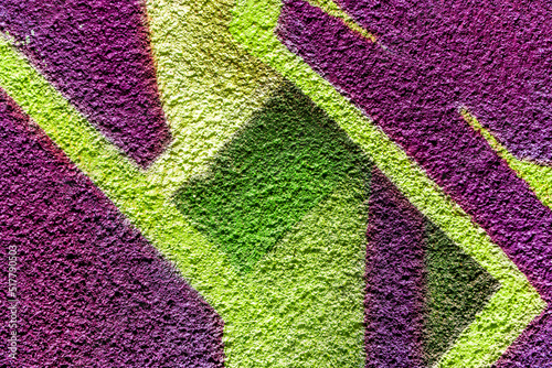 Art under ground. Beautiful street art graffiti background. The wall is decorated with abstract drawings house paint. Modern style urban culture of street youth. Abstract picture on wall