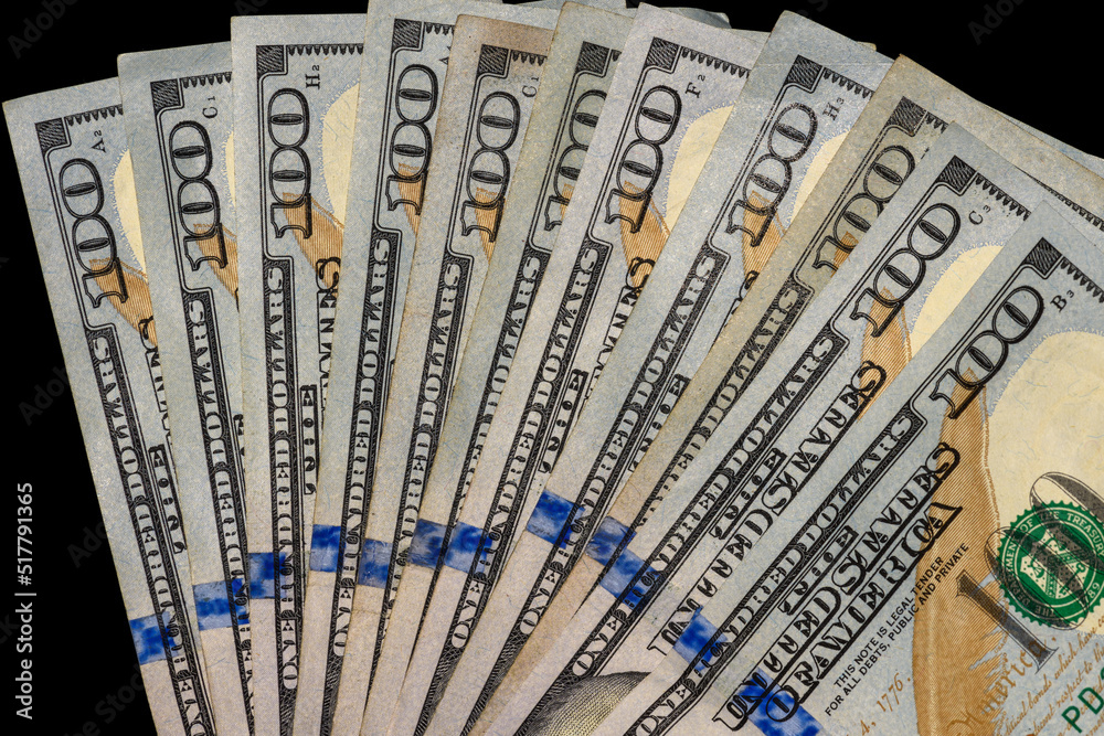 100 Dollar Bills fanned on black Background 100 Dollar Bills fanned on black Background