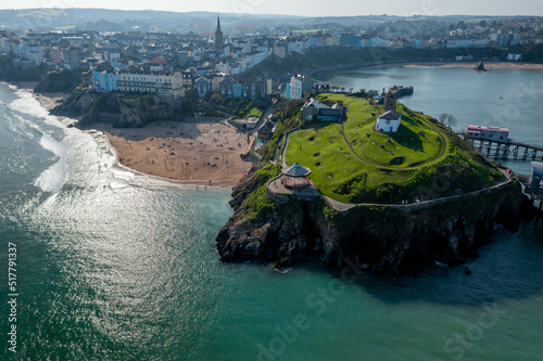 Aerial drone view of a beautiful coast town with sandy beaches and colorful buildings Tenby, Wales, UK