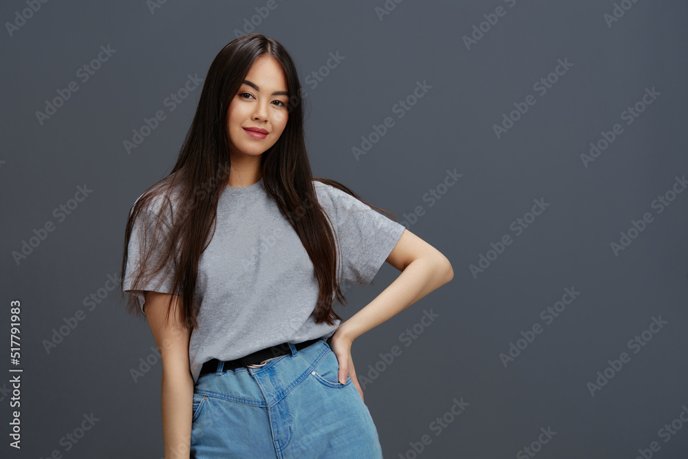 young woman in a t-shirt and jeans posing Youth style Lifestyle