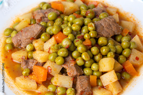 Turkish Food Green Pea Stew with Meatballs - Kofte or Kofta Bezelye. (Turkish name; kofteli bezelye) photo