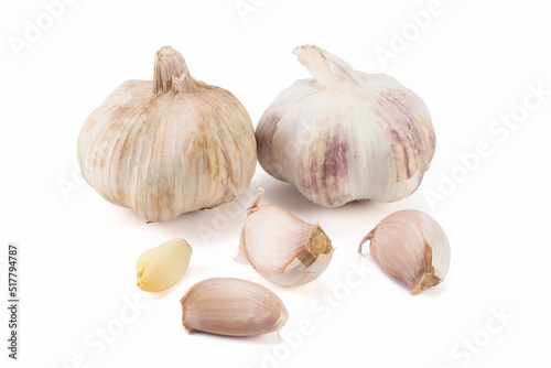 Garlic and cloves, isolated on bright backgrounds. Close up view.
