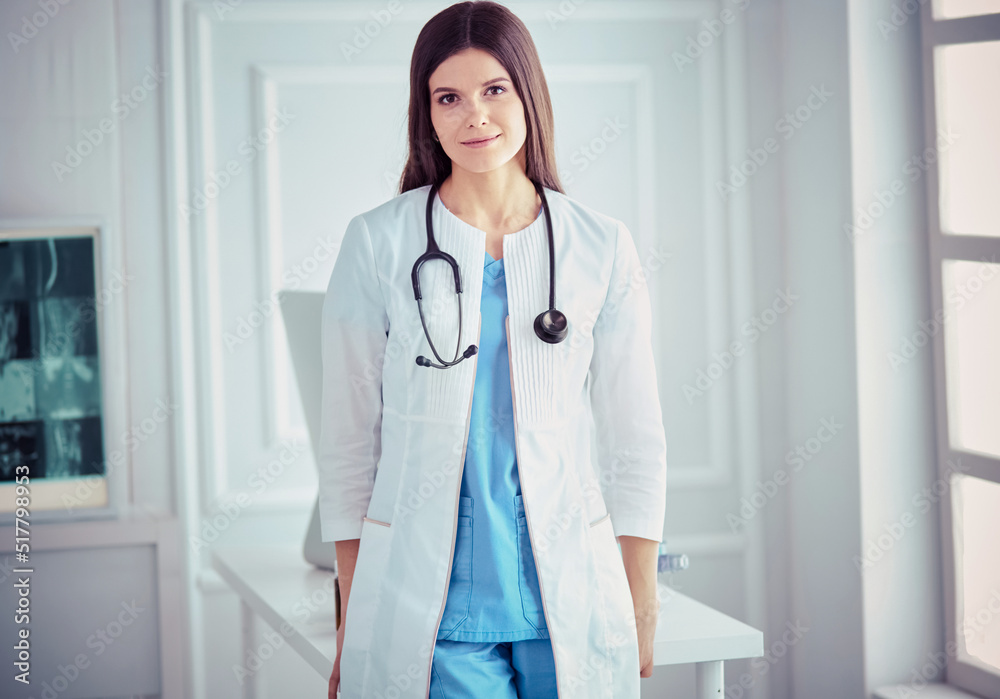 Female doctor standing at hospita with her stethoscope hanging on her neck Female doctor standing at hospita with her stethoscope hanging on her neck
