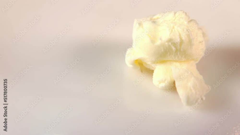 Macro view of popcorn. Close-up view of a kernel of corn exploding and turning into popcorn. Macro view of popcorn. Close-up view of a kernel of corn exploding and turning into popcorn.