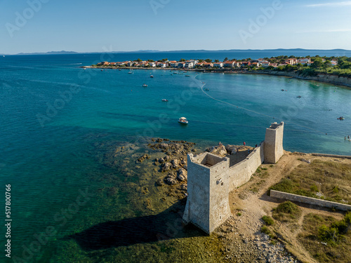 Croatia - The amazing Vir island with an old castle near the sea from drone view