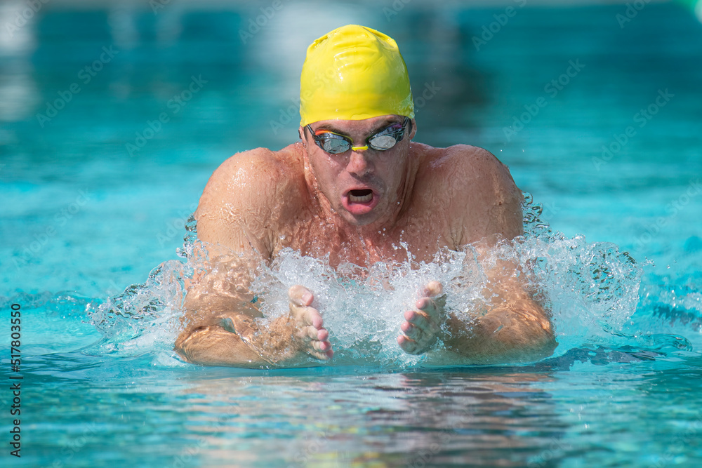 Clsoe up of a man swimming breaststroke