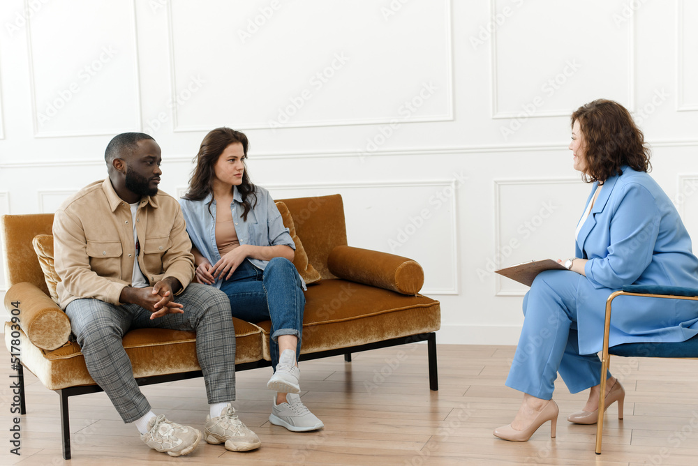 A diverse couple came to a session with a psychologist. Relationship problems, avoiding divorce