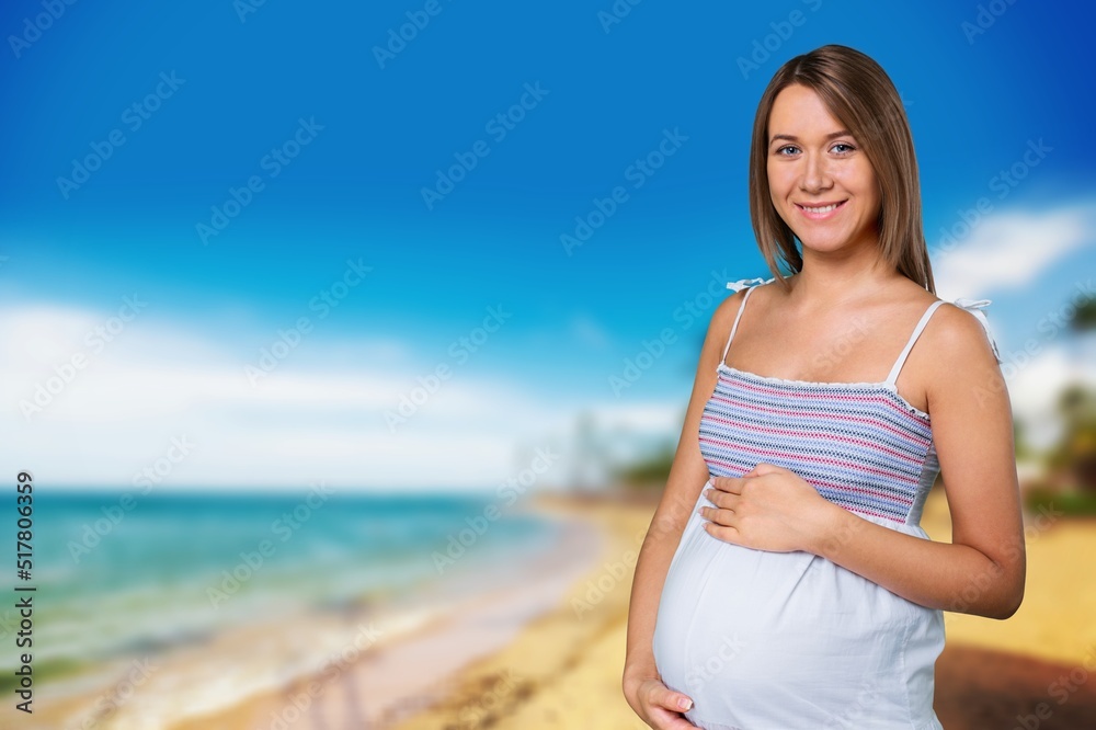 Pregnant woman on the beach happy mood. Happy pregnant woman Walking on beach.