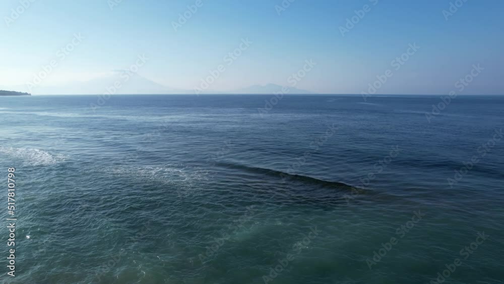 Aerial view of drone slide forward. Surf point and ocean closeout wave. Horizon drone shot at cloudy day Aerial view of drone slide forward. Surf point and ocean closeout wave. Horizon drone shot at cloudy day