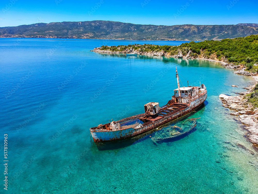Aerial view over rusty shipwreck of an old cargo boat at Peristera island near Alonissos, Greece