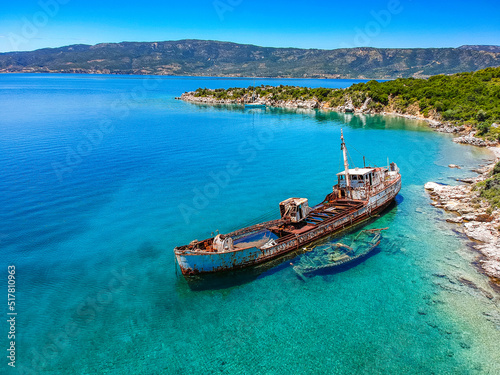 Aerial view over rusty shipwreck of an old cargo boat at Peristera island near Alonissos, Greece