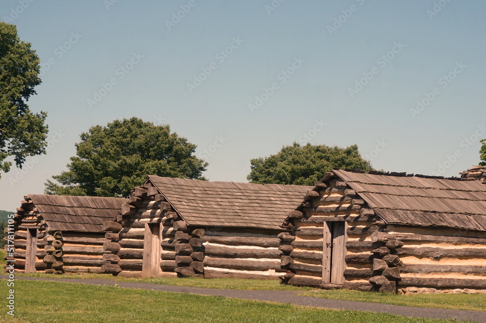 Three Consecutive Log Cabins at Valley Forge in Summer
