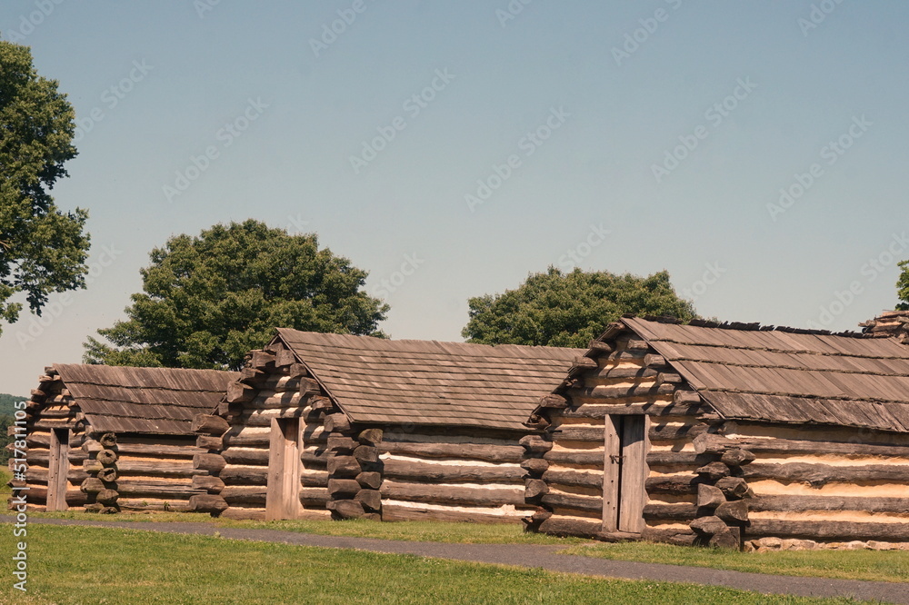 Three Consecutive Log Cabins at Valley Forge in Summer Three Consecutive Log Cabins at Valley Forge in Summer