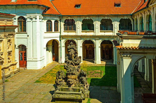 Canvas Print Courtyard of the Loreta monastery in Praha with beautiful baroque buildings and statues