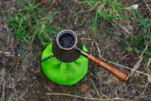 Tourist stove gas for camping and recreation on the background of nature. © vadish