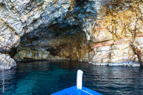 Boat trip view towards the famous caves of Votsi beach in Alonnisos island. Unique geological formation and rocky scenery in Sporades, Greece photo