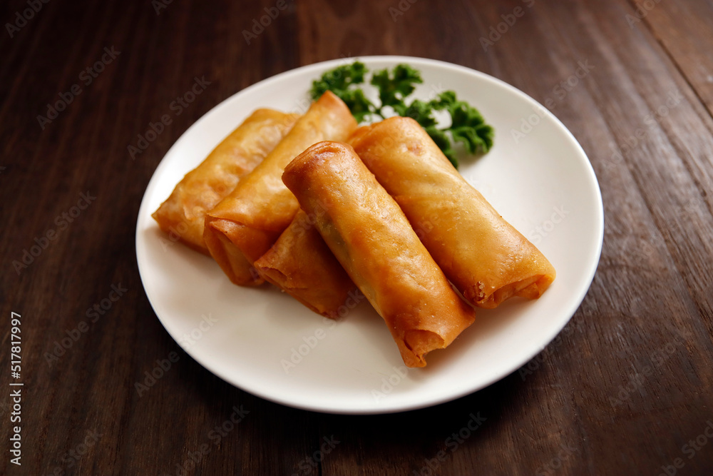 Multiple fried spring rolls on the table Multiple fried spring rolls on the table
