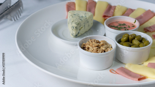 plate with chesse nuts and snacks