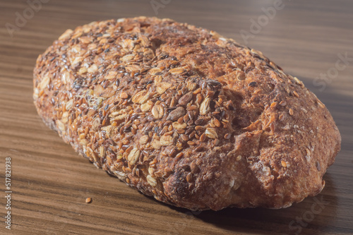 Whole wheat rye bread slice with seeds, multigrain bread on a wooden table with copy space