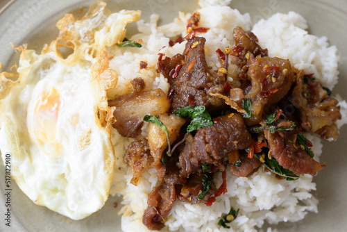 Stir fried basil with beef and fried egg for lunch menu.Traditional Thai street food.Spicy taste menu