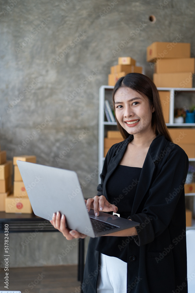 Starting small businesses SME owners female entrepreneurs check online orders to prepare to pack the boxes, sell to customers, sme business ideas online. Starting small businesses SME owners female entrepreneurs check online orders to prepare to pack the boxes, sell to customers, sme business ideas online.