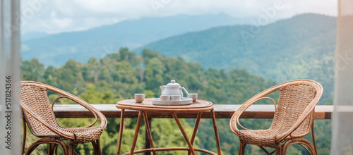 teapot set on table in the morning with mountain view at countryside home or homestay. Vacation, travel and trip concept