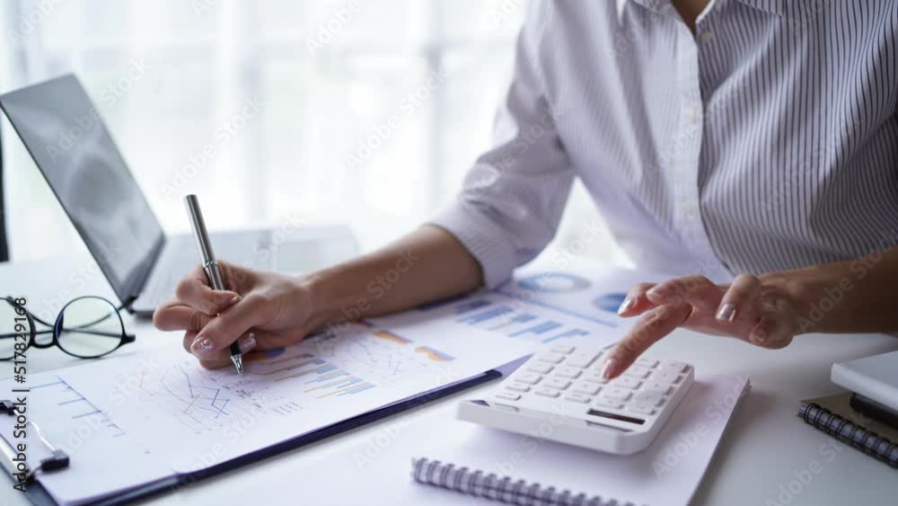 Business accounting concept, Business man using calculator with computer laptop, budget and loan paper in office. Business accounting concept, Business man using calculator with computer laptop, budget and loan paper in office.