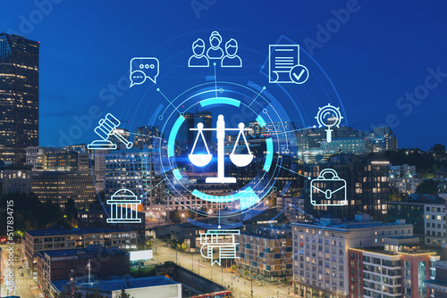 Illuminated aerial cityscape of Seattle, downtown at night time, Washington, USA. Glowing hologram legal icons. The concept of law, order, regulations and digital justice