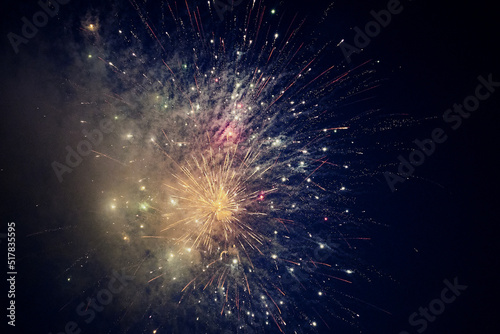 multicolored lights of fireworks exploding in the night sky