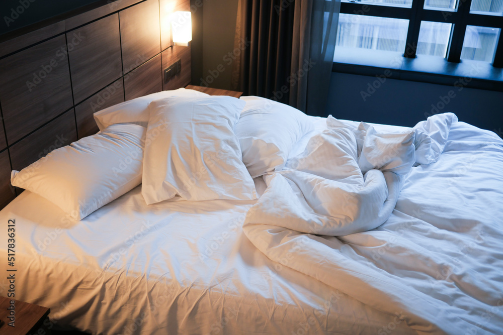 Fototapeta premium messy bed in early morning , messy bed after waking up