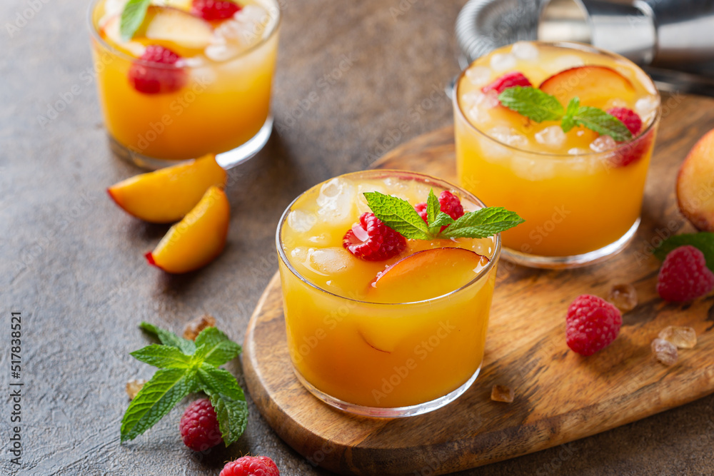 Summer refreshing drink, beverage, cocktail with peach and raspberry Summer refreshing drink, beverage, cocktail with peach and raspberry