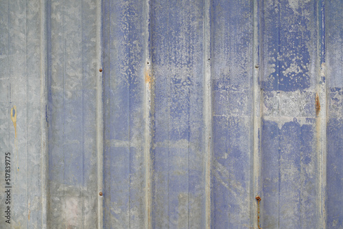 gray blue wall background in metallic metal panel with worn and degraded old paint