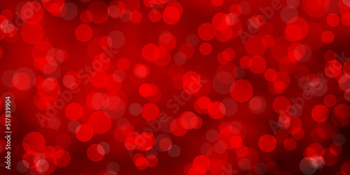 Light Red vector background with circles.