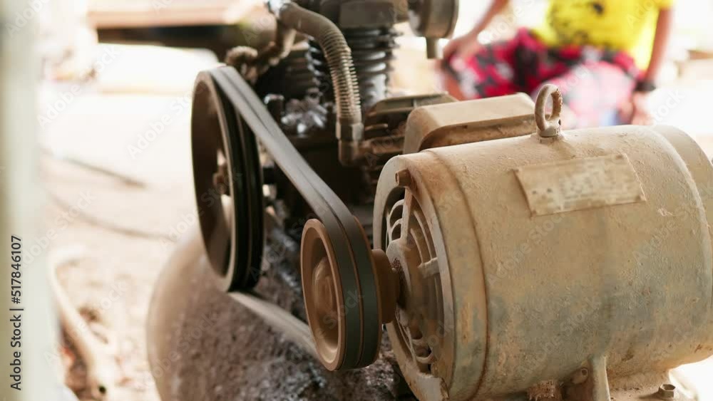 Close-up shot of belt rotation of an air compressor.