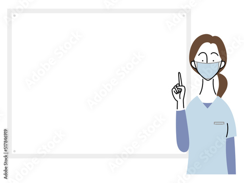 指をさして説明する女性歯科医（水色ユニフォーム）
