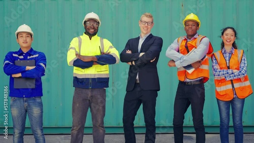 Full shot of groups shipping workers walking toward to camera and smile. Professional logistics staff and teamwork concept.
