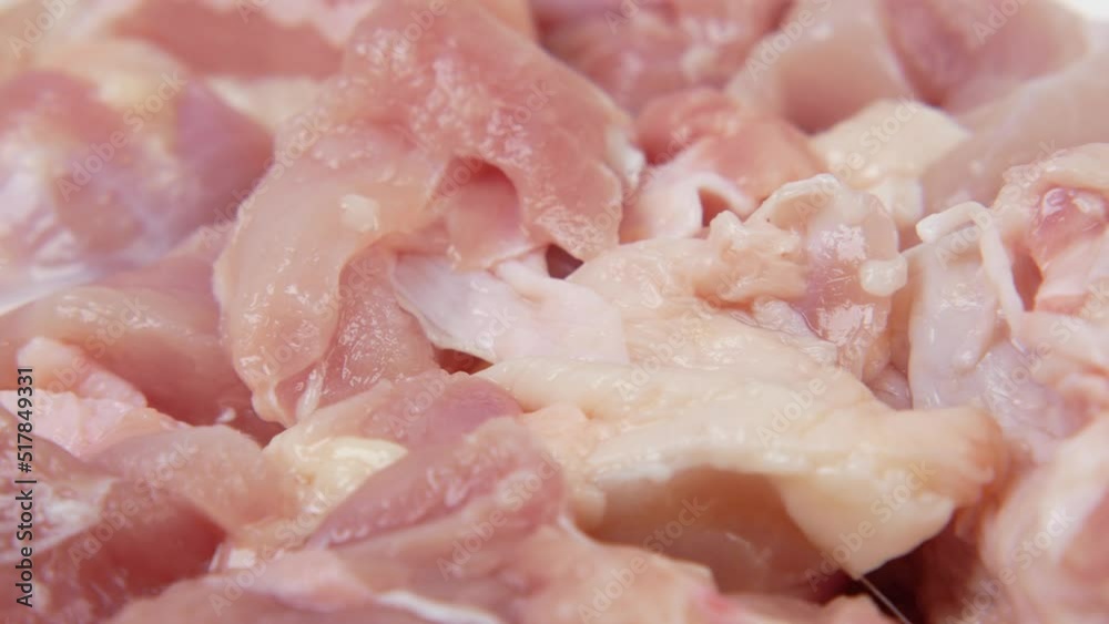 raw chicken slice in a bowl on white raw chicken slice in a bowl on white