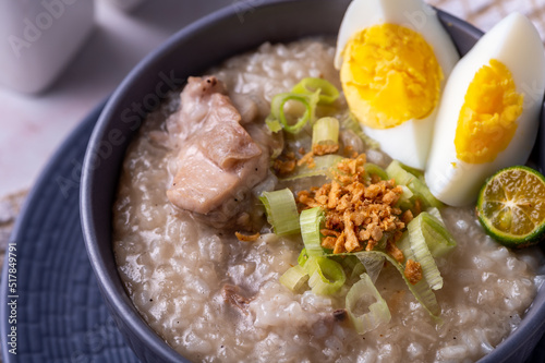Arroz caldo, is a Filipino rice and chicken gruel heavily infused with ginger and garnished with toasted garlic, scallions, and black pepper. It is usually served with calamansi or fish sauce (patis) 