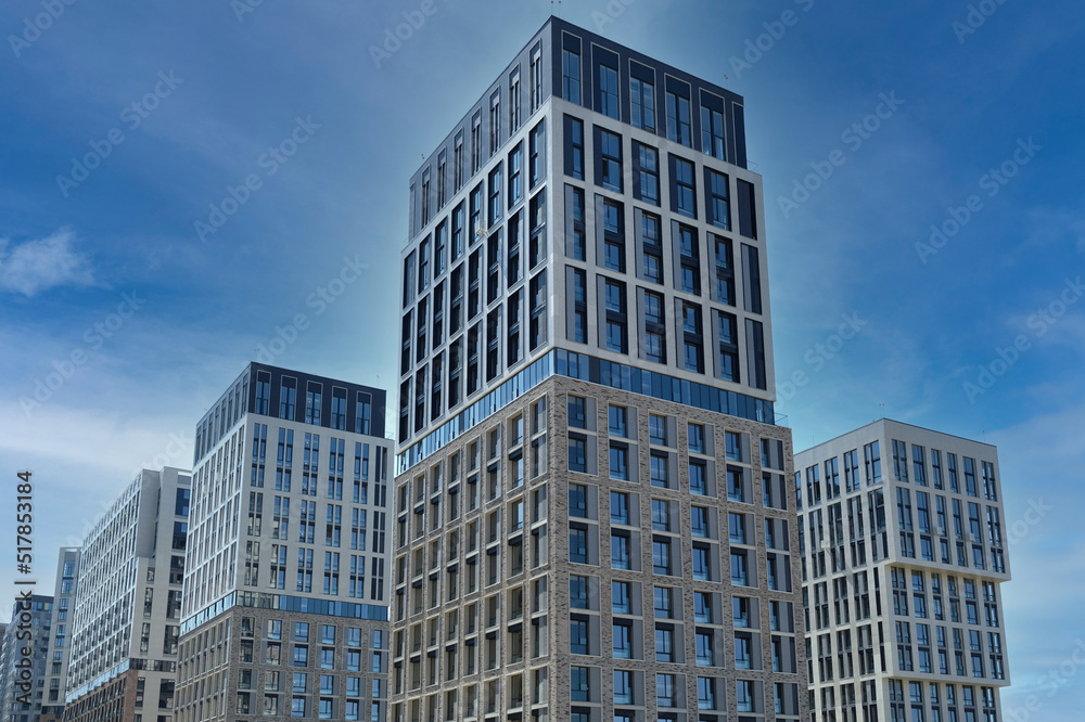Exterior of a modern building house object with texture walls and windows. Luxury modern tall block of flats without balconies. Living apartments or office building. Real estate concept. Exterior of a modern building house object with texture walls and windows. Luxury modern tall block of flats without balconies. Living apartments or office building. Real estate concept.
