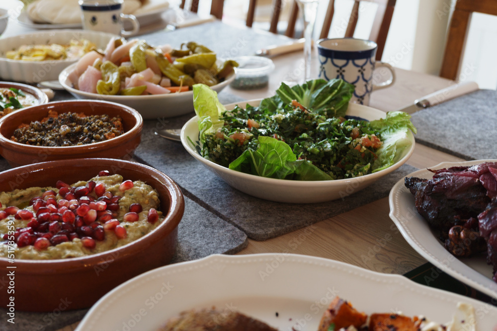 A selection of traditional Arabic dishes served for a mezze style lunch. Lebanese, Moroccan, middle eastern food photo.