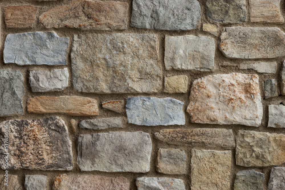 Obraz premium Rustic stone wall close up. Stone wall background
