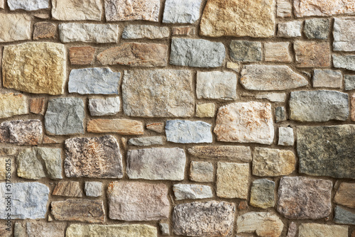 Rustic stone wall close up. Stone wall background