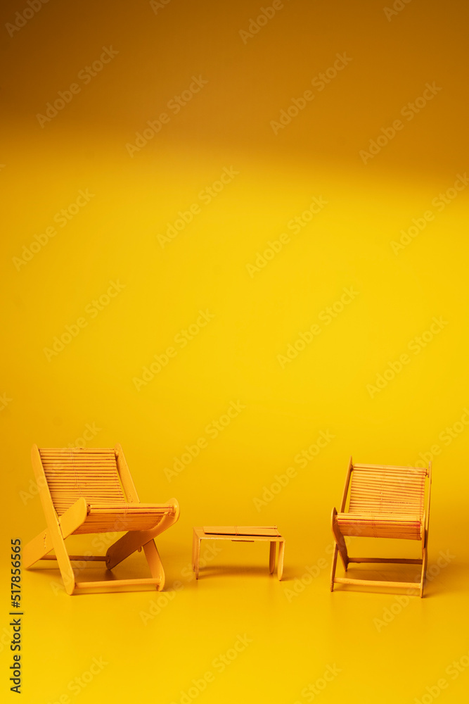 Beach chairs on yellow background. - Summer concept. Beach chairs on yellow background. - Summer concept.
