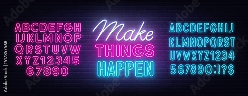 Make Things Happen neon quote on a brick wall.